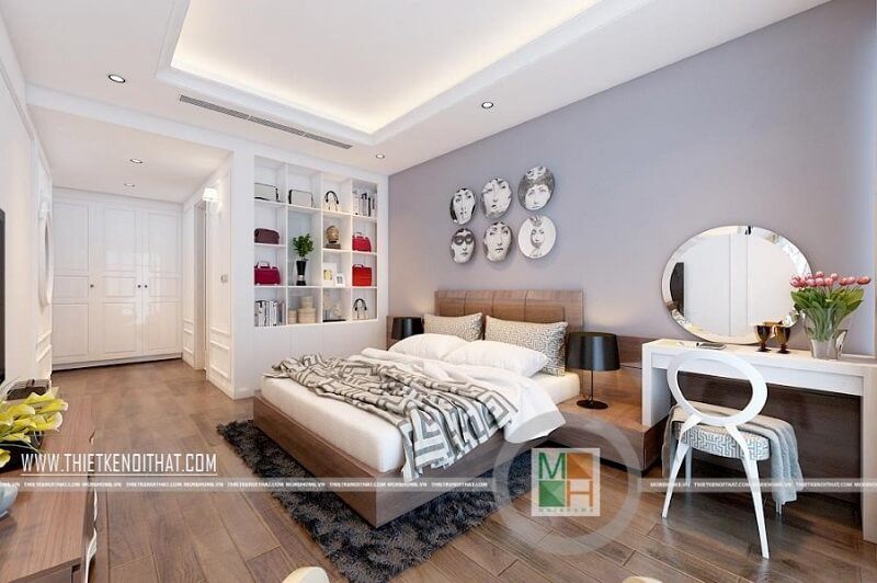Trang trí phòng ngủ chung cư hiện đại sử dụng đồ nội thất tông màu trắng chủ đạo kết hợp tranh treo tường ấn tượng mang đến sự sang trọng cho căn phòng.
